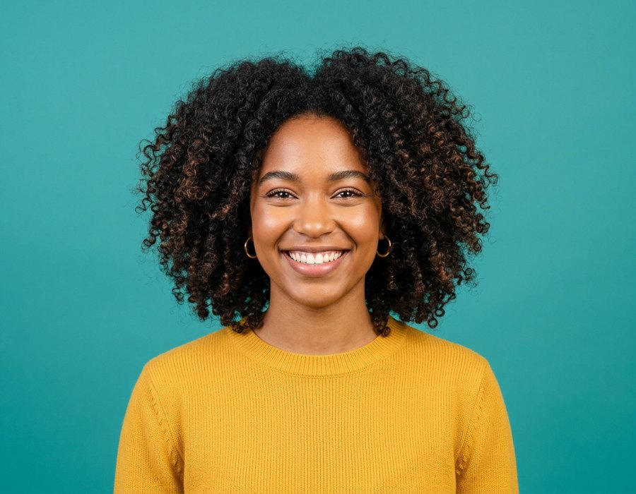 High contrast studio portrait of a smiling woman, an ideal source photo for a paint by numbers portrait template